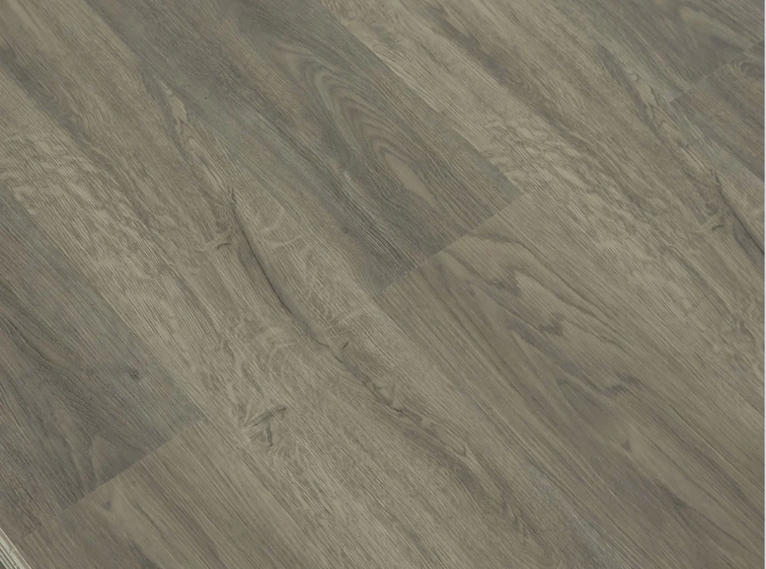 Congo SPC vinyl flooring, angled close-up of the grain and plank joints.